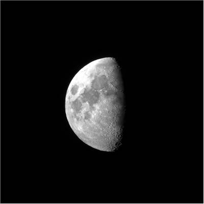 Picture Of Half Moon Seen From A Small Telescope